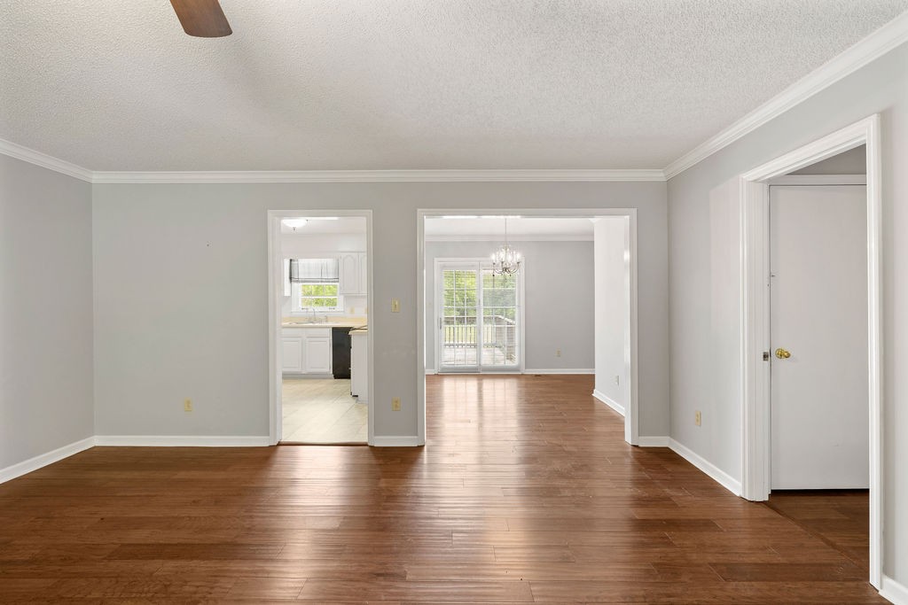 1684 Springplace Road Lewisburg, TN 37091 - Photo 3 of 31 a view of an empty room with wooden floor and a window
