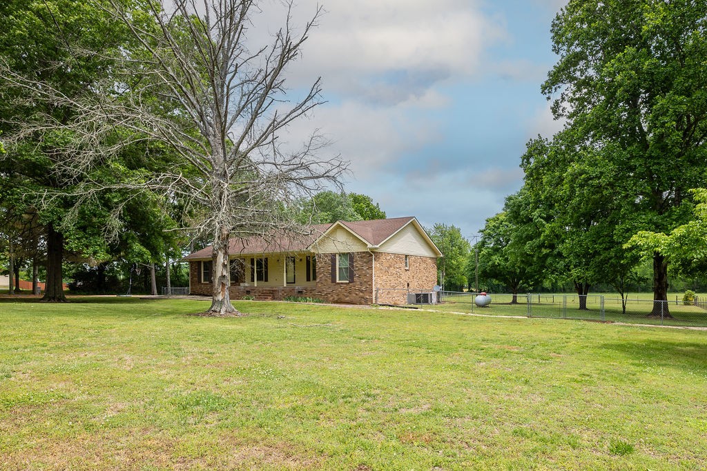 1684 Springplace Road Lewisburg, TN 37091 - Photo 31 of 31 a front view of a house with a yard