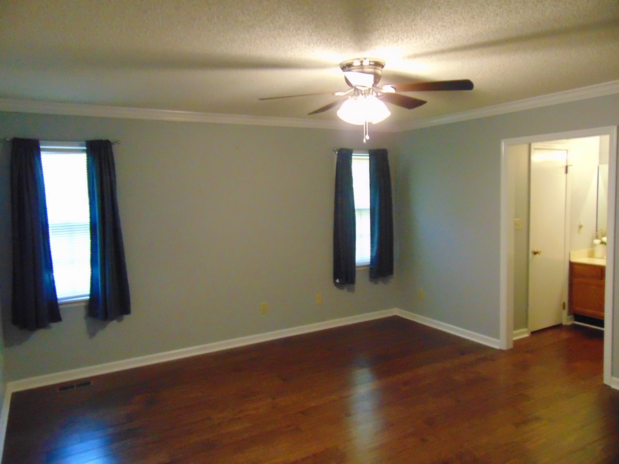 1684 Springplace Road Lewisburg, TN 37091 - Photo 4 of 48 a view of an empty room with wooden floor and a window