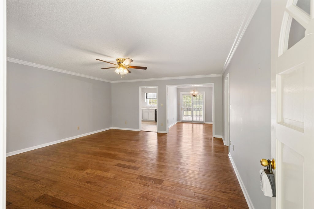 1684 Springplace Road Lewisburg, TN 37091 - Photo 4 of 31 a view of an empty room with wooden floor and a window