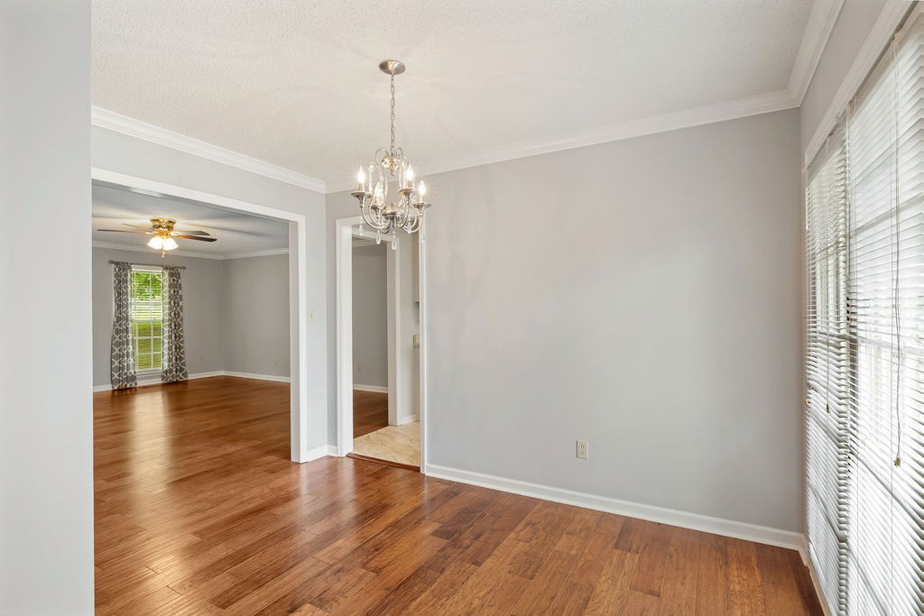 1684 Springplace Road Lewisburg, TN 37091 - Photo 5 of 31 a view of an empty room with wooden floor and a window