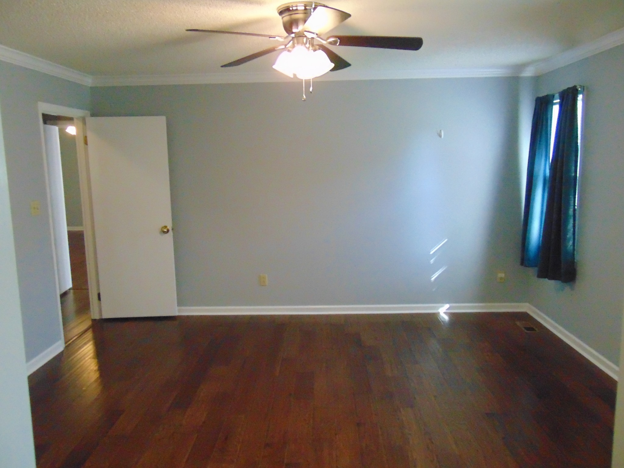 1684 Springplace Road Lewisburg, TN 37091 - Photo 5 of 48 an empty room with wooden floor and windows