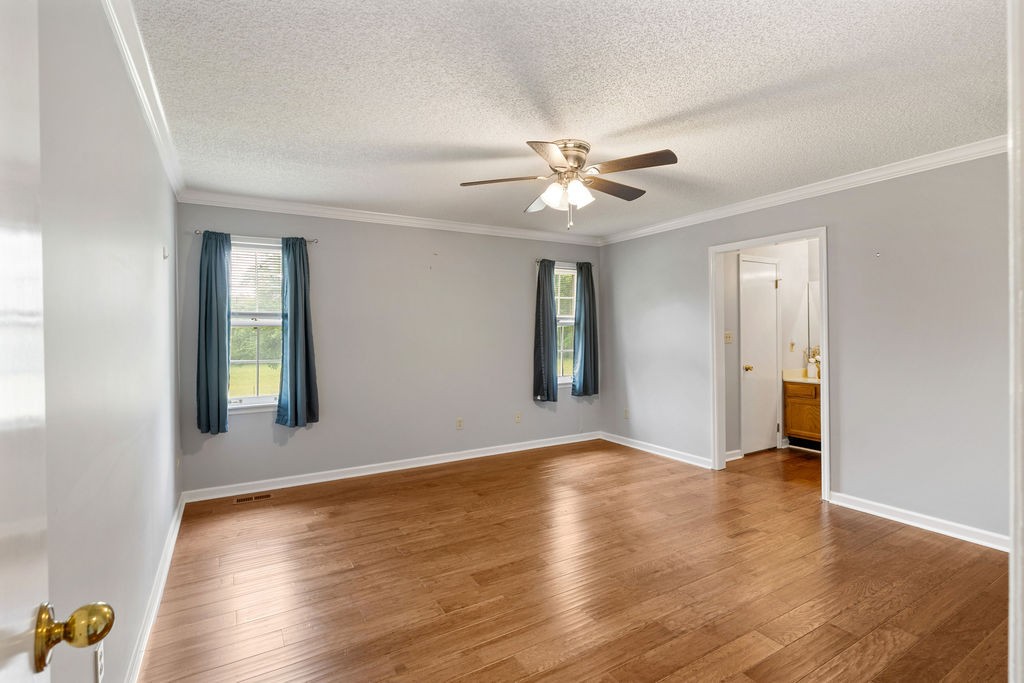 1684 Springplace Road Lewisburg, TN 37091 - Photo 6 of 31 a view of an empty room with window and wooden floor