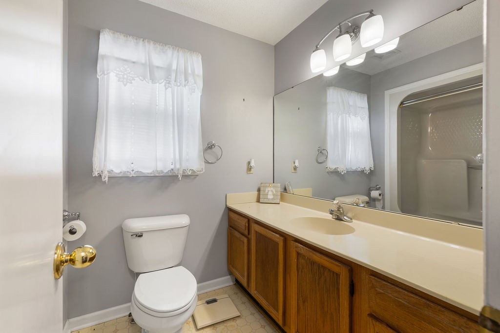 1684 Springplace Road Lewisburg, TN 37091 - Photo 10 of 31 a bathroom with a sink a toilet and a mirror