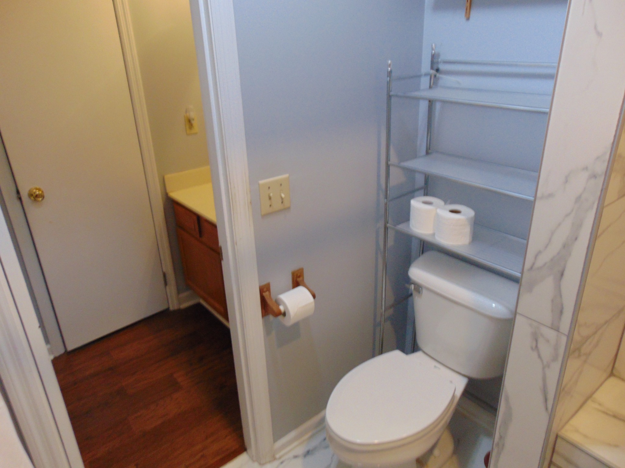 1684 Springplace Road Lewisburg, TN 37091 - Photo 10 of 48 a white toilet sitting next to a sink