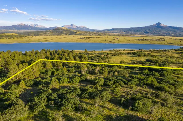 a view of an ocean and a mountain