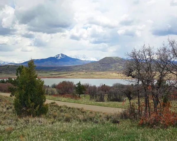 a view of a lake with mountain in front of it