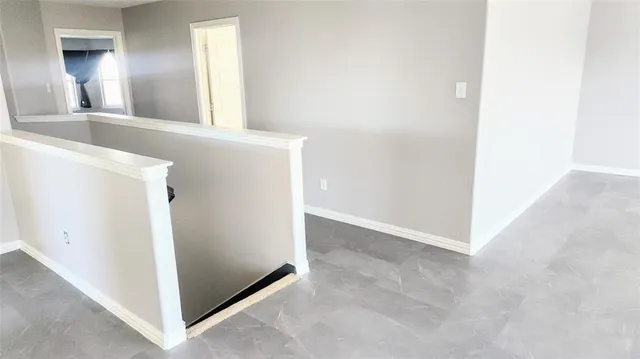 a view of a bathroom from a hallway