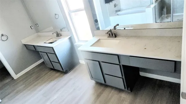 a bathroom with a sink and a mirror