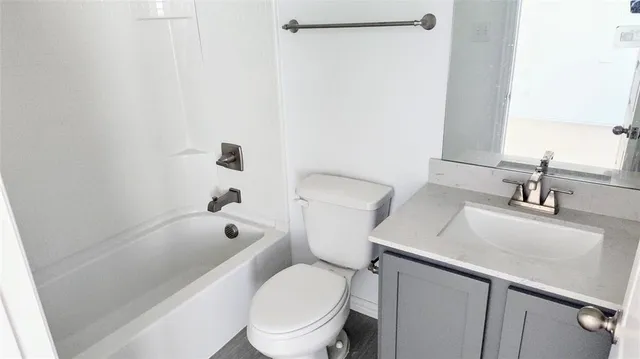 a view of a room with a hallway and toilet