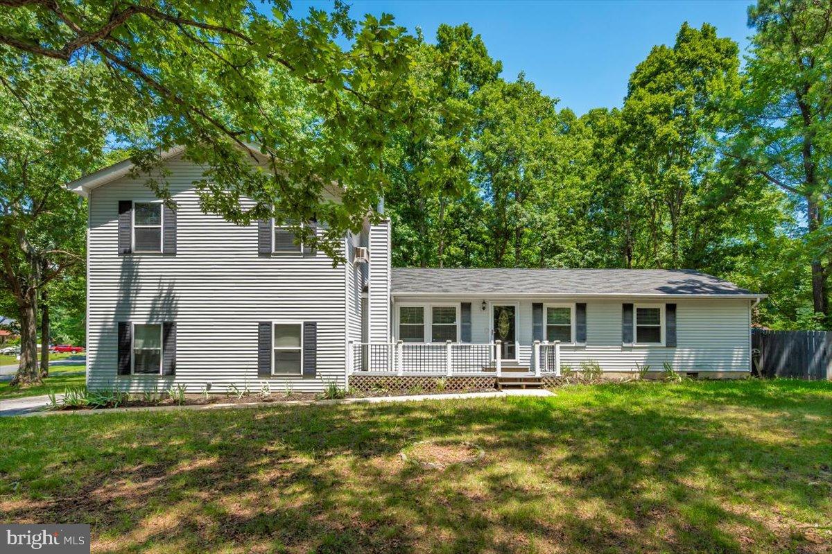 12284 Bandera Lane Lusby, MD 20657 - Photo 1 of 55 front view of a house with a yard