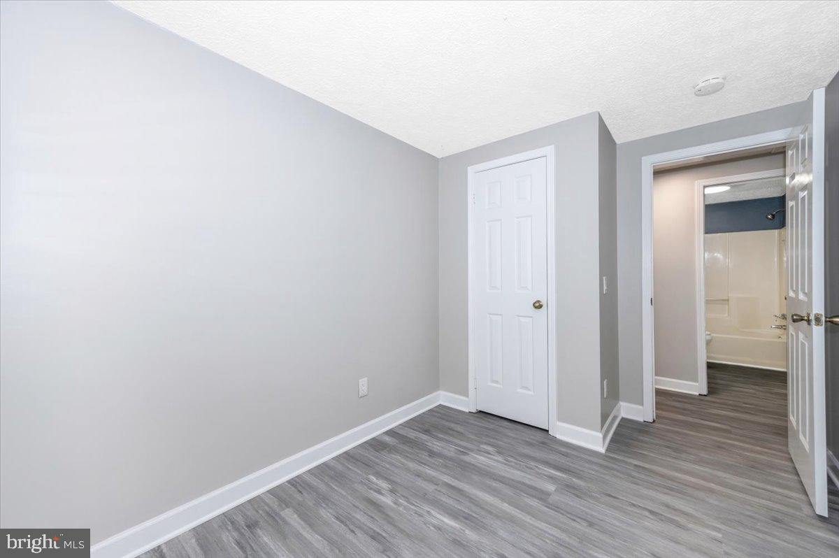 12284 Bandera Lane Lusby, MD 20657 - Photo 27 of 55 a view of an empty room with wooden floor