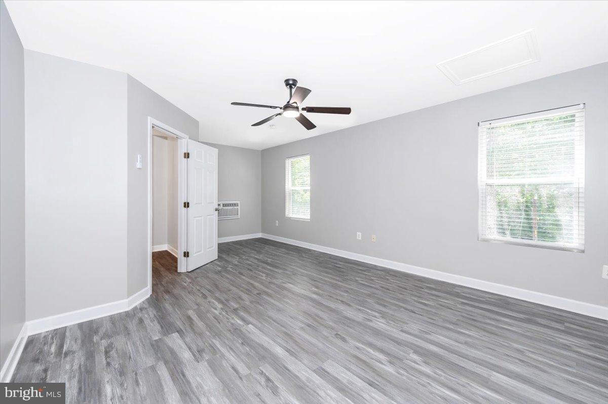 12284 Bandera Lane Lusby, MD 20657 - Photo 33 of 55 an empty room with wooden floor and ceiling fan