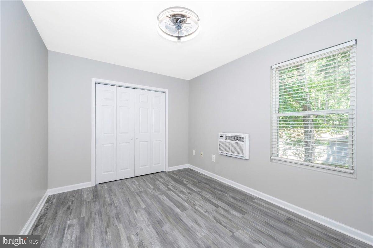 12284 Bandera Lane Lusby, MD 20657 - Photo 34 of 55 a view of empty room with wooden floor and fan