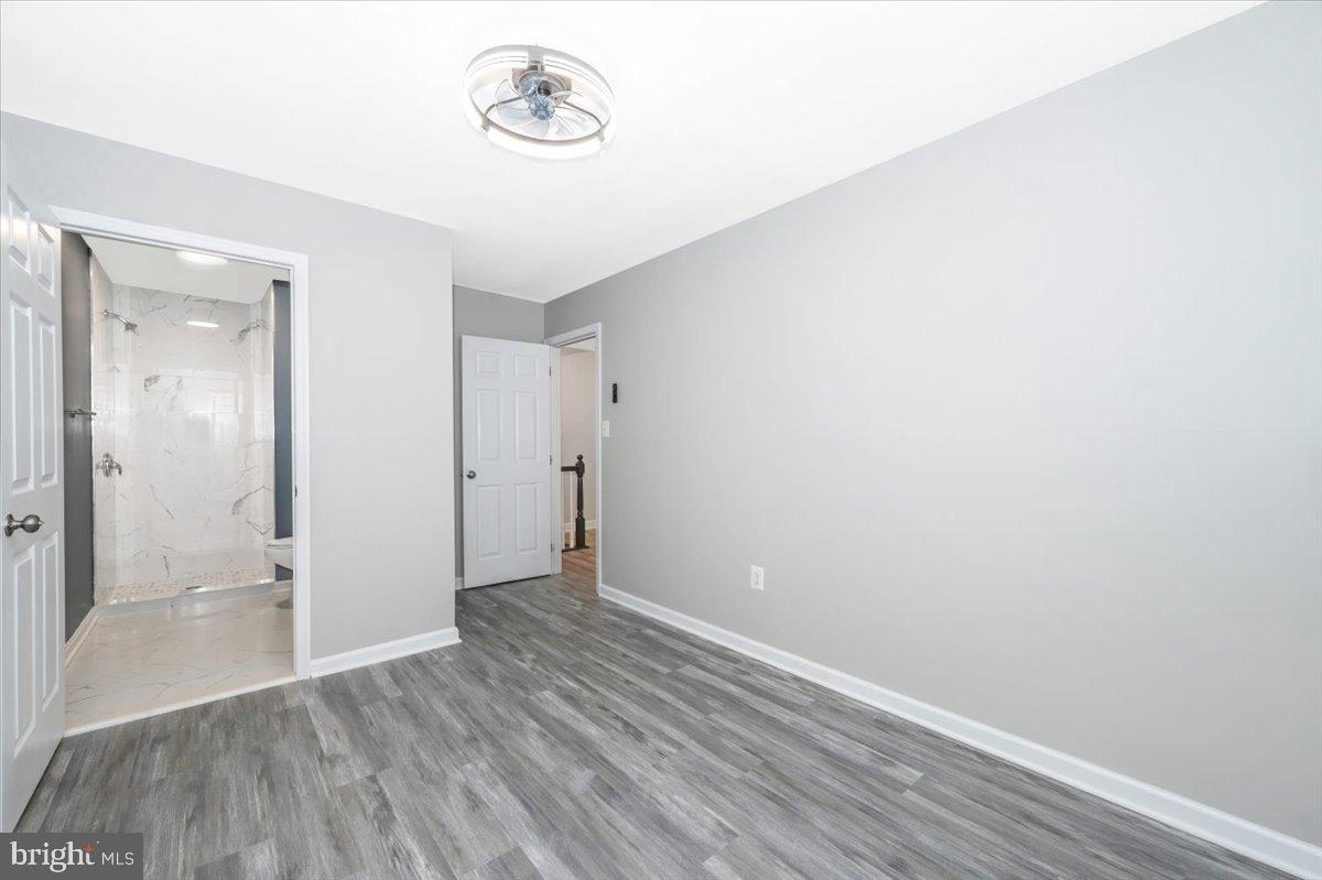 12284 Bandera Lane Lusby, MD 20657 - Photo 35 of 55 Spacious, modern room with sleek flooring.