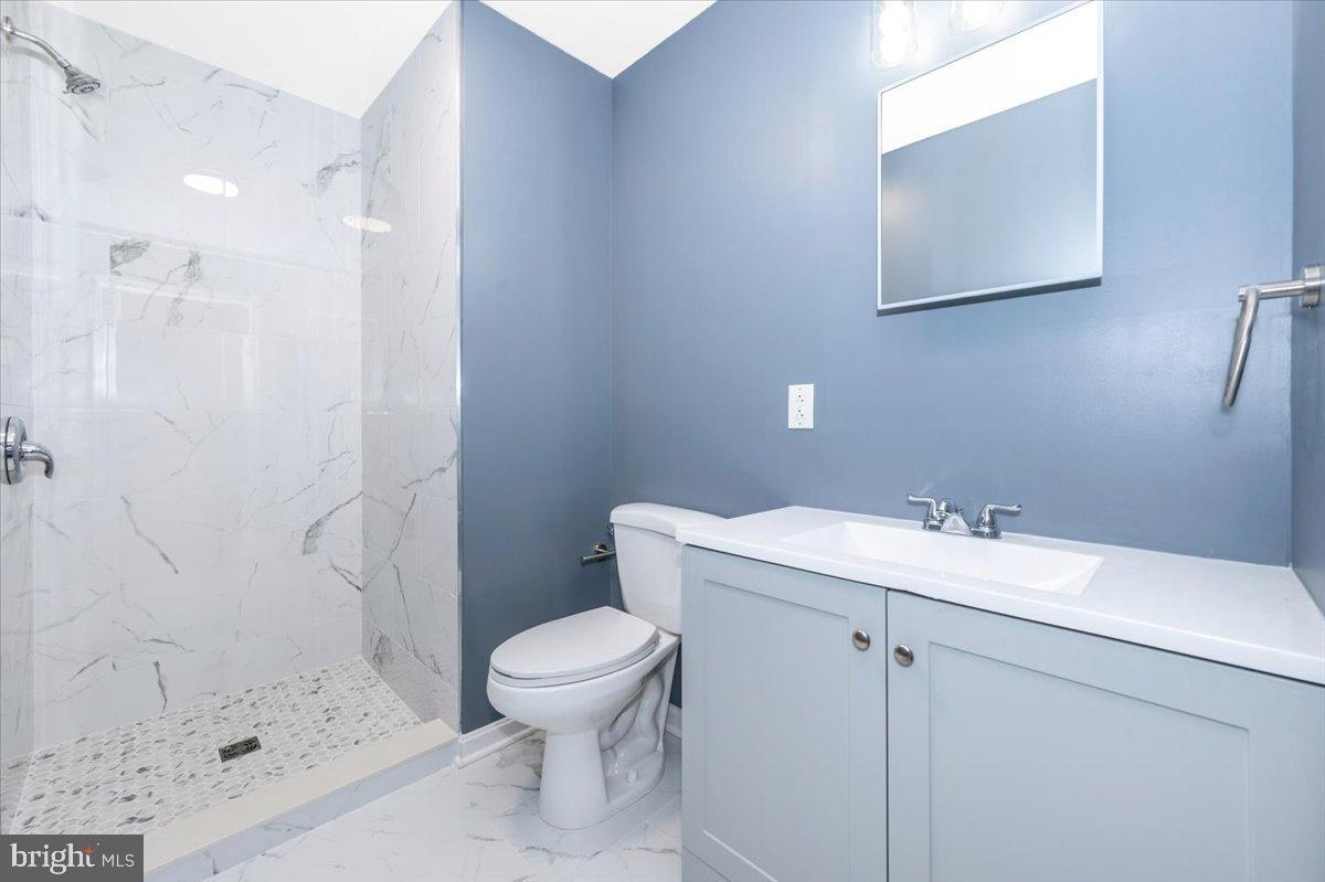 12284 Bandera Lane Lusby, MD 20657 - Photo 36 of 55 a bathroom with a sink toilet and shower