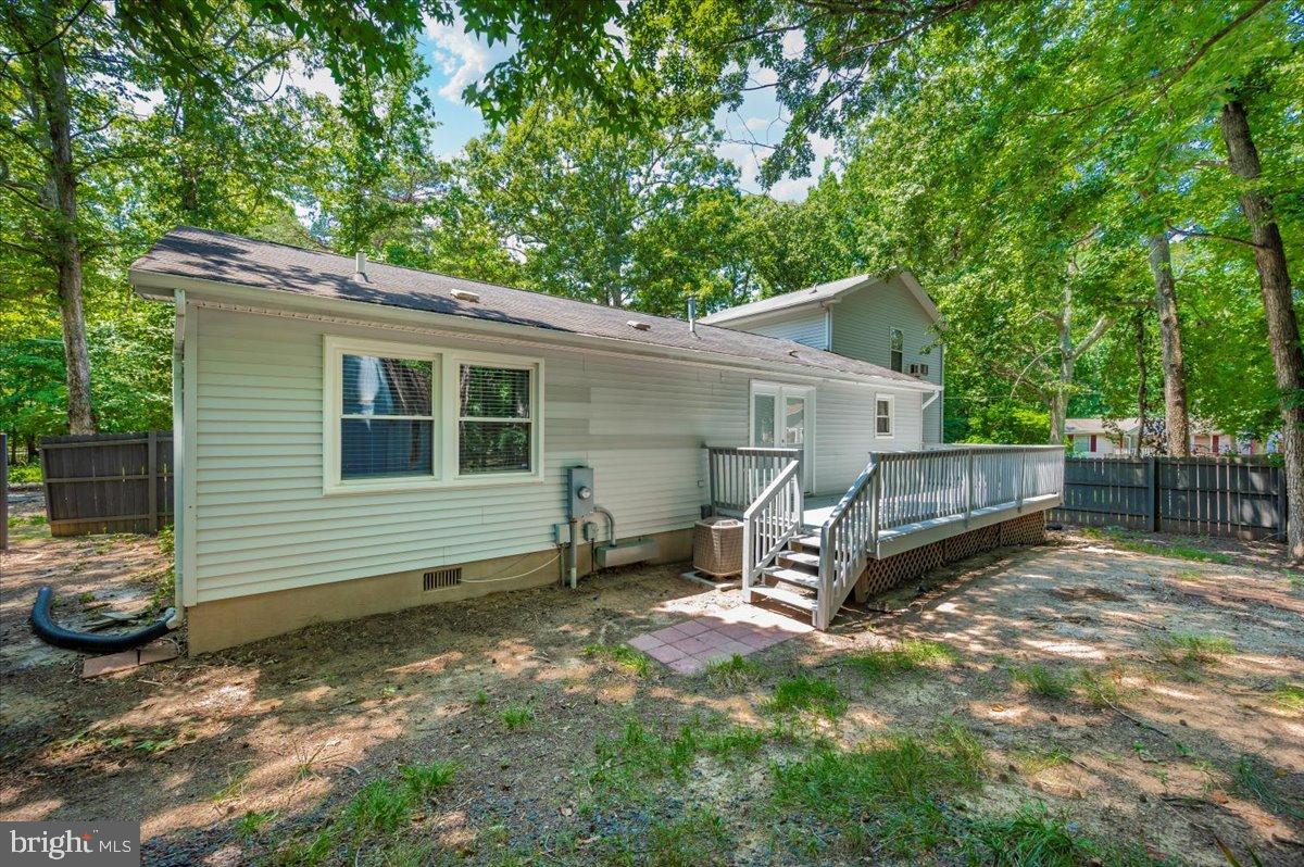 12284 Bandera Lane Lusby, MD 20657 - Photo 39 of 55 a view of a house with a yard