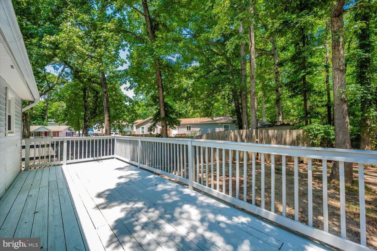 12284 Bandera Lane Lusby, MD 20657 - Photo 45 of 55 a view of deck with a large trees