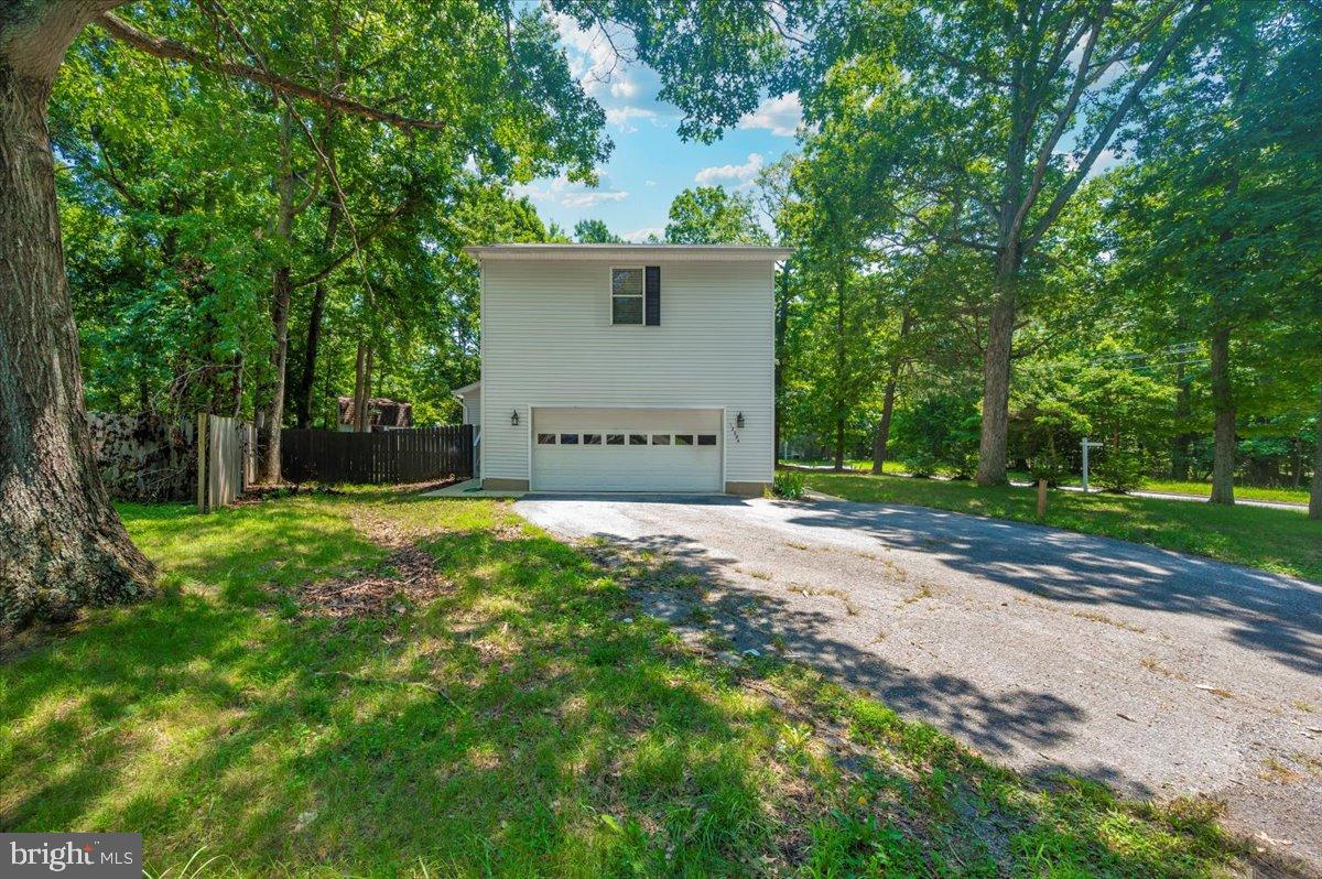 12284 Bandera Lane Lusby, MD 20657 - Photo 48 of 55 a view of a house with a yard