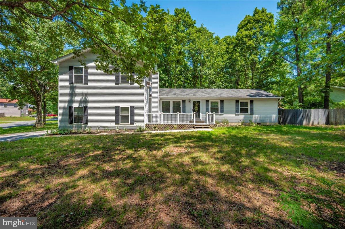 12284 Bandera Lane Lusby, MD 20657 - Photo 50 of 55 a view of a house with a yard balcony and a tree