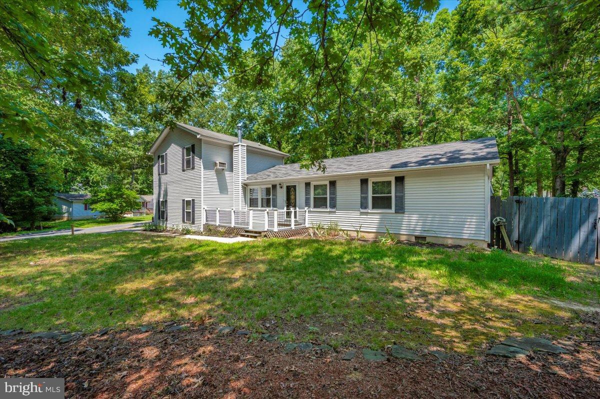 12284 Bandera Lane Lusby, MD 20657 - Photo 51 of 55 a front view of house with yard and green space