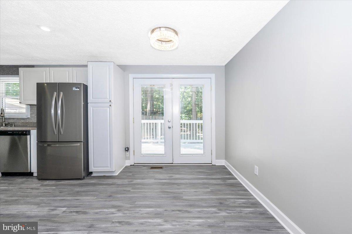 12284 Bandera Lane Lusby, MD 20657 - Photo 8 of 55 Bright and airy space with nature views.