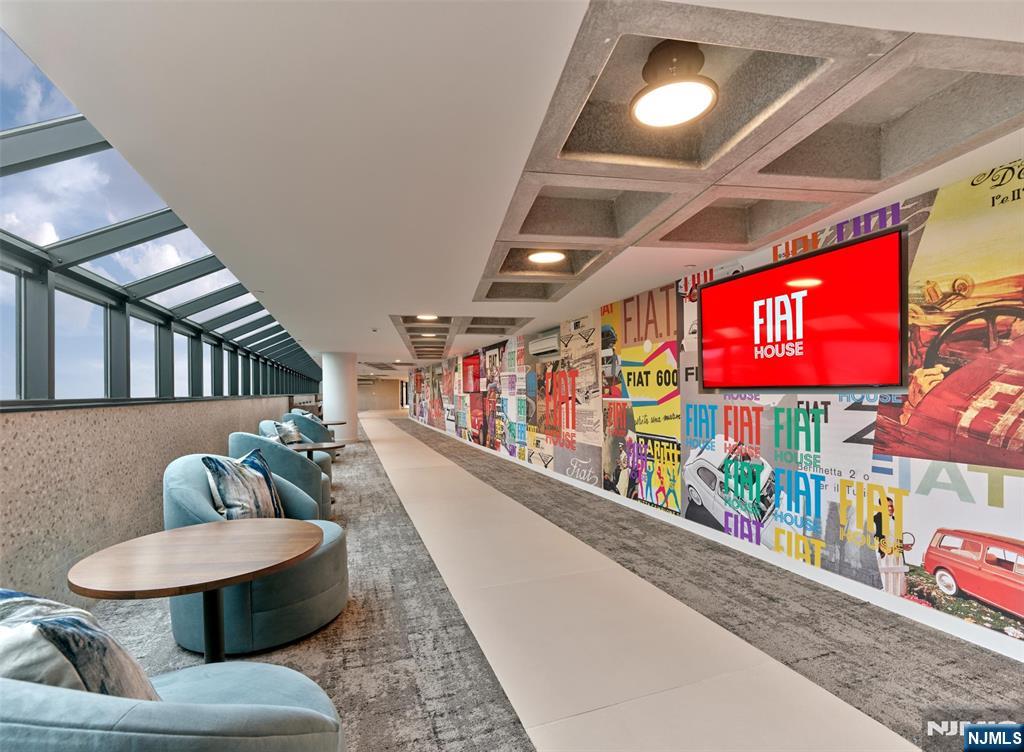 2100 Central Road, Unit 706B Fort Lee, NJ 07024 - Photo 2 of 19 a group of people sitting on a street