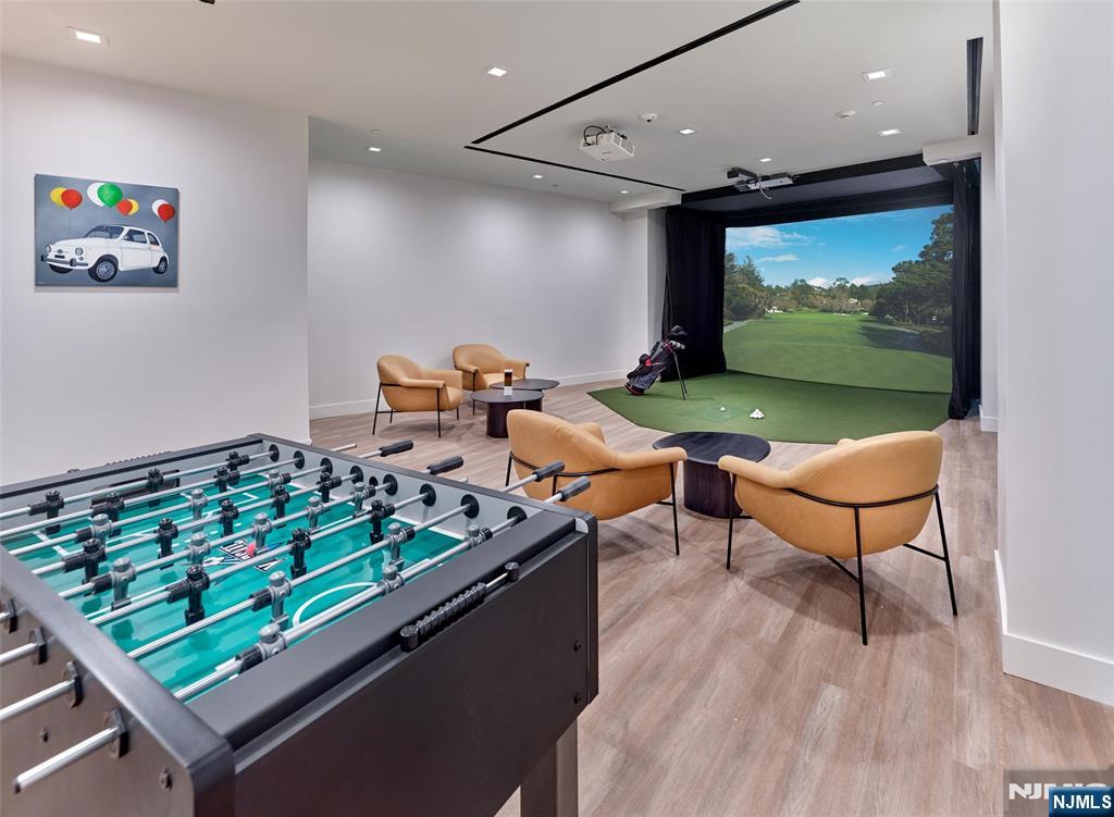 2100 Central Road, Unit 706B Fort Lee, NJ 07024 - Photo 8 of 19 an outdoor room with chairs pool and wooden floor