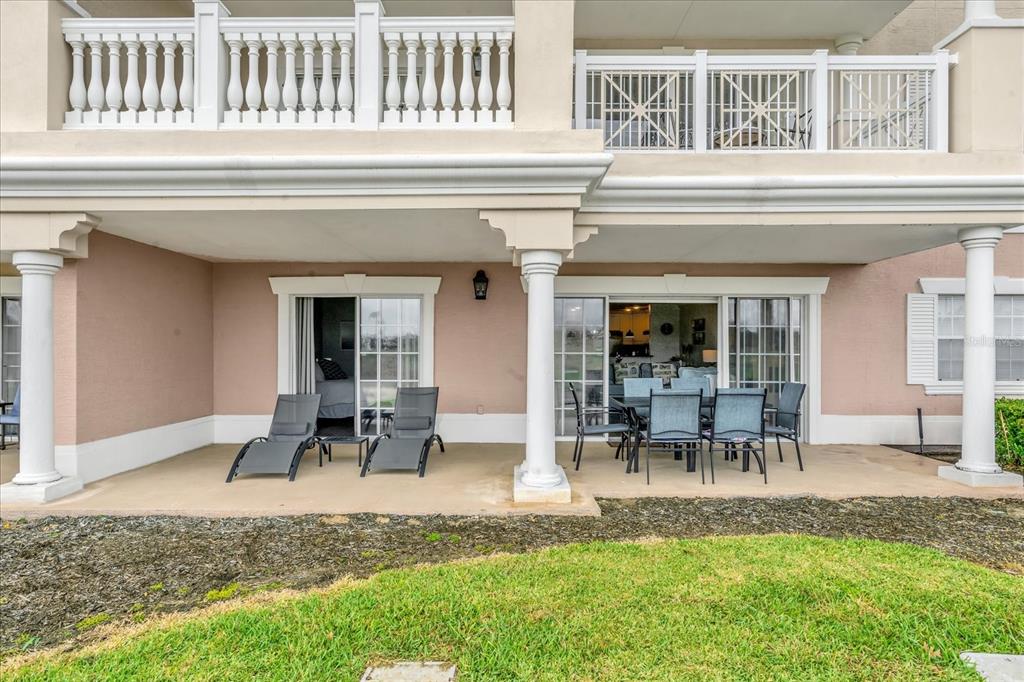 1362 Centre Ct Ridge Drive, Unit 102 Reunion, FL 34747 - Photo 24 of 35 a view of front door and outdoor seating