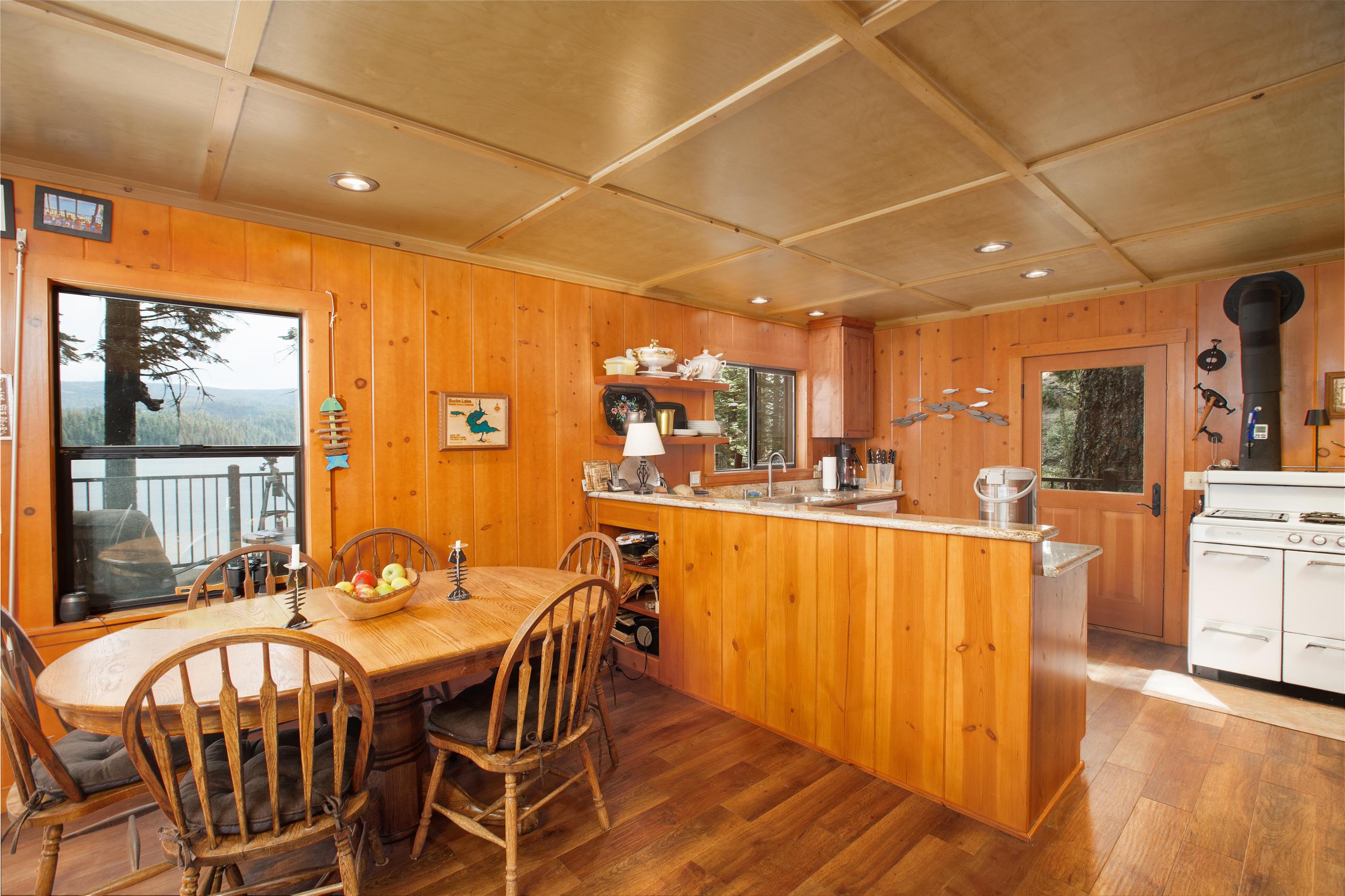 278 Mile High Road Quincy, CA 95971 - Photo 8 of 38 a dining area with stainless steel appliances a dining table chairs and view of living room