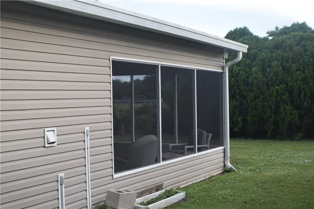 a view of backyard with cabin