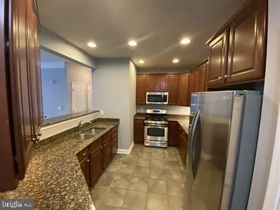 a view of an empty room with a bathroom