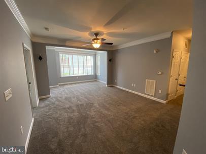 621 Cobblestone Boulevard, Unit T3 Fredericksburg, VA 22401 - Photo 15 of 34 a view of a big room with windows and chandelier fan