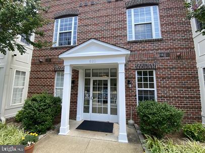 621 Cobblestone Boulevard, Unit T3 Fredericksburg, VA 22401 - Photo 2 of 34 a front view of a house with a yard