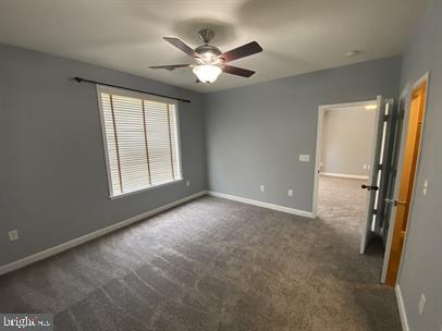 621 Cobblestone Boulevard, Unit T3 Fredericksburg, VA 22401 - Photo 21 of 34 an empty room with windows and fan