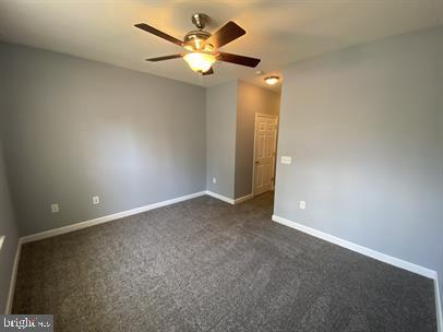 621 Cobblestone Boulevard, Unit T3 Fredericksburg, VA 22401 - Photo 24 of 34 an empty room with a fan & a window