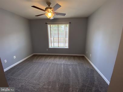 621 Cobblestone Boulevard, Unit T3 Fredericksburg, VA 22401 - Photo 26 of 34 an empty room with a window and a fan
