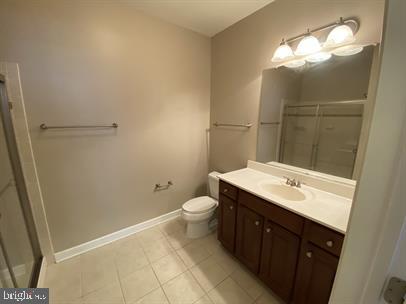 621 Cobblestone Boulevard, Unit T3 Fredericksburg, VA 22401 - Photo 31 of 34 a bathroom with a toilet sink and mirror