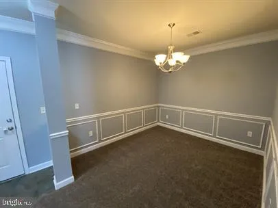 a kitchen with granite countertop stainless steel appliances a refrigerator and a stove top oven