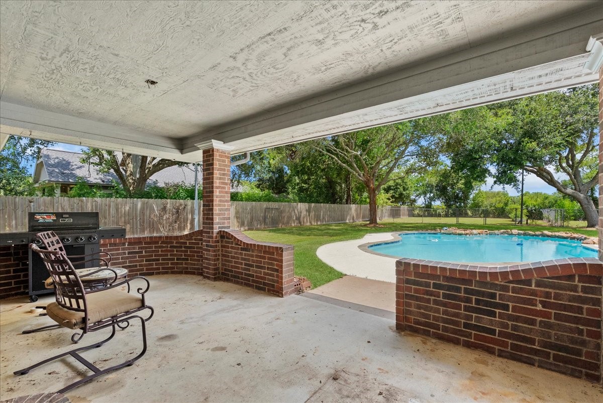 5255 Beaver Road Santa Fe, TX 77517 - Photo 37 of 46 Covered back patio with view of pool