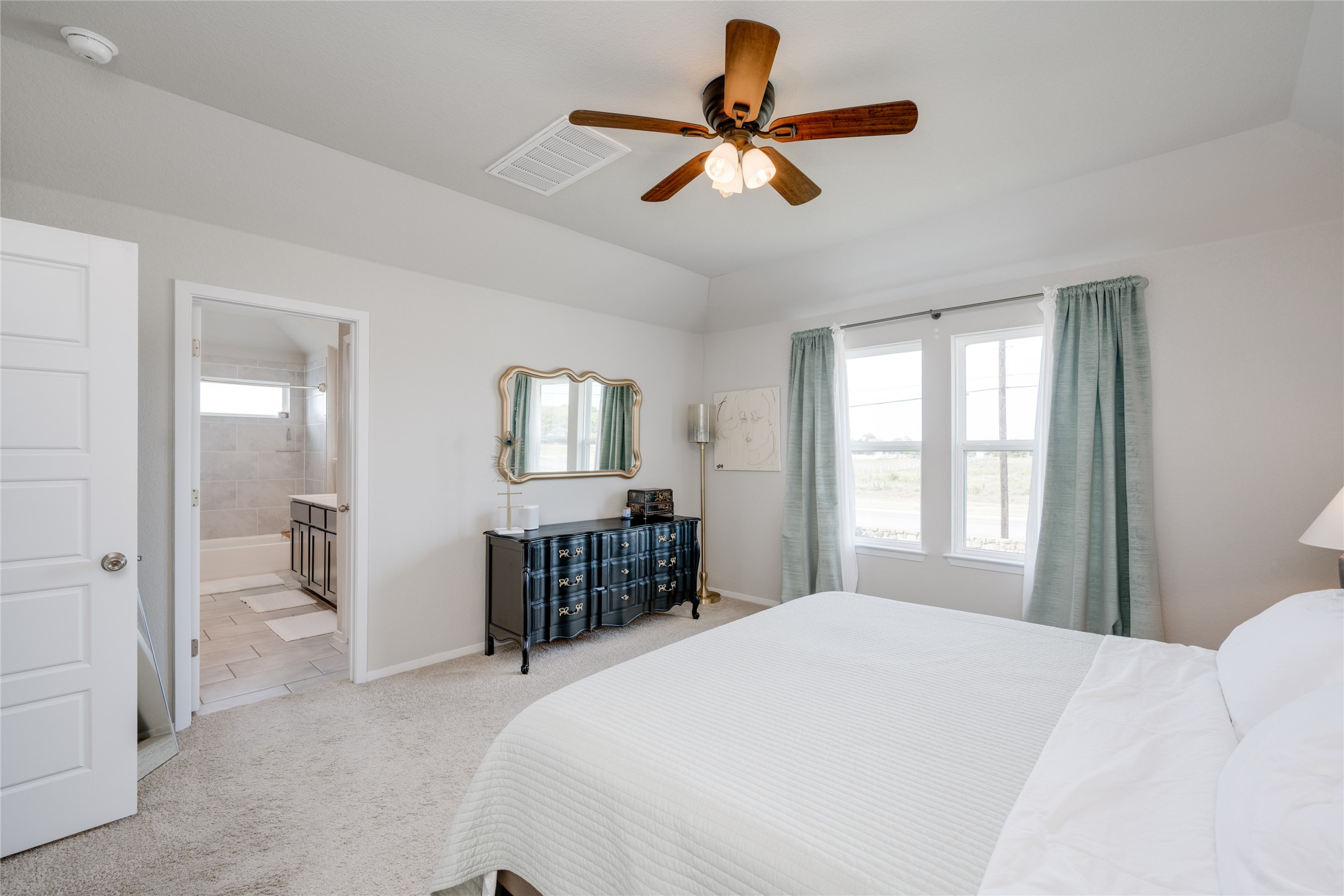 7948 Castelardo Place Round Rock, TX 78665 - Photo 4 of 32 a bedroom with a bed a chandelier and a window