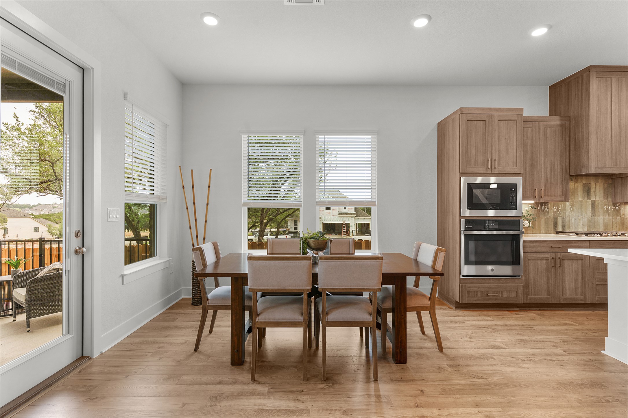 104 Beautiful Wisdom Court Georgetown, TX 78628 - Photo 11 of 33 a view of a dining room with furniture window and wooden floor