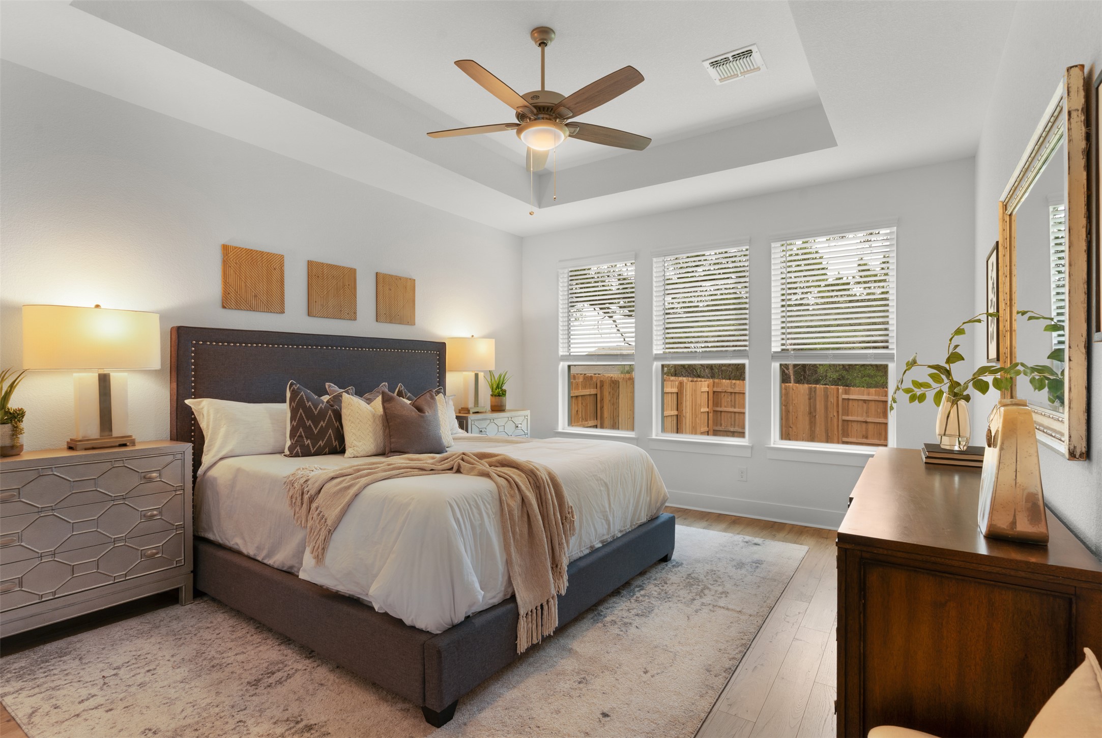 104 Beautiful Wisdom Court Georgetown, TX 78628 - Photo 14 of 33 a spacious bedroom with a large bed and a large window