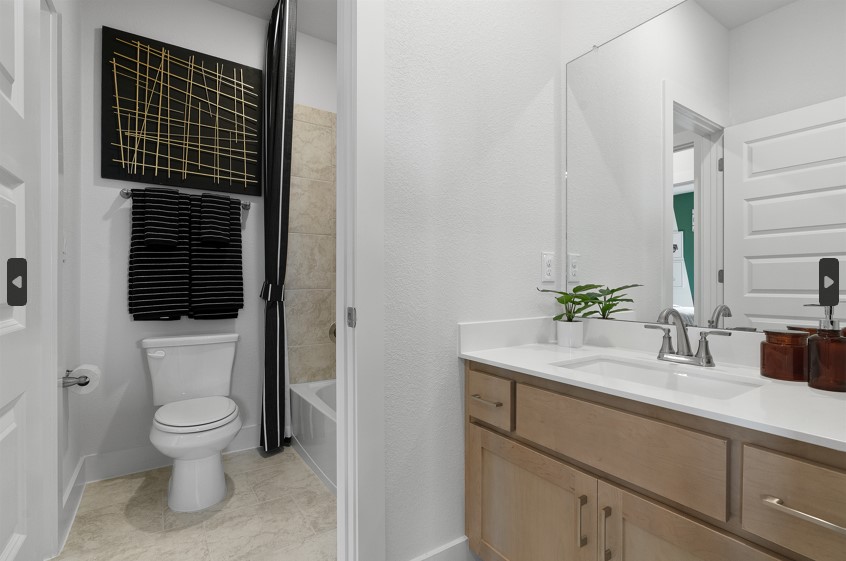 104 Beautiful Wisdom Court Georgetown, TX 78628 - Photo 20 of 29 a bathroom with a granite countertop sink toilet and mirror