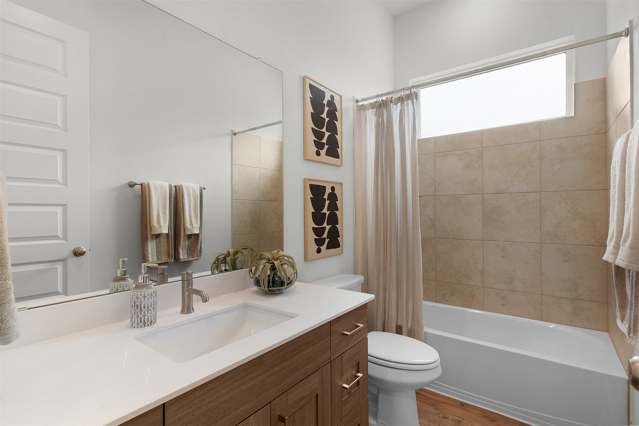 104 Beautiful Wisdom Court Georgetown, TX 78628 - Photo 5 of 33 a bathroom with a sink a toilet and shower