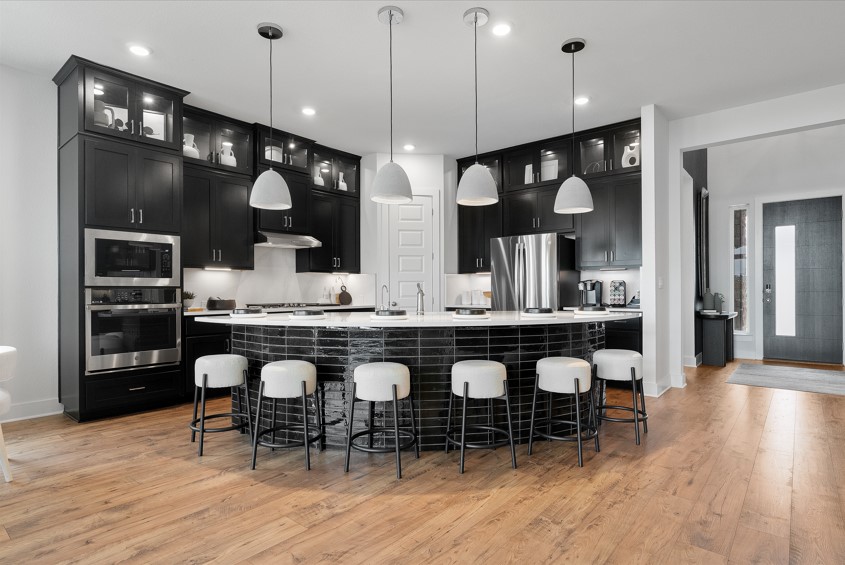 104 Beautiful Wisdom Court Georgetown, TX 78628 - Photo 6 of 29 a large kitchen with a table and chairs in it