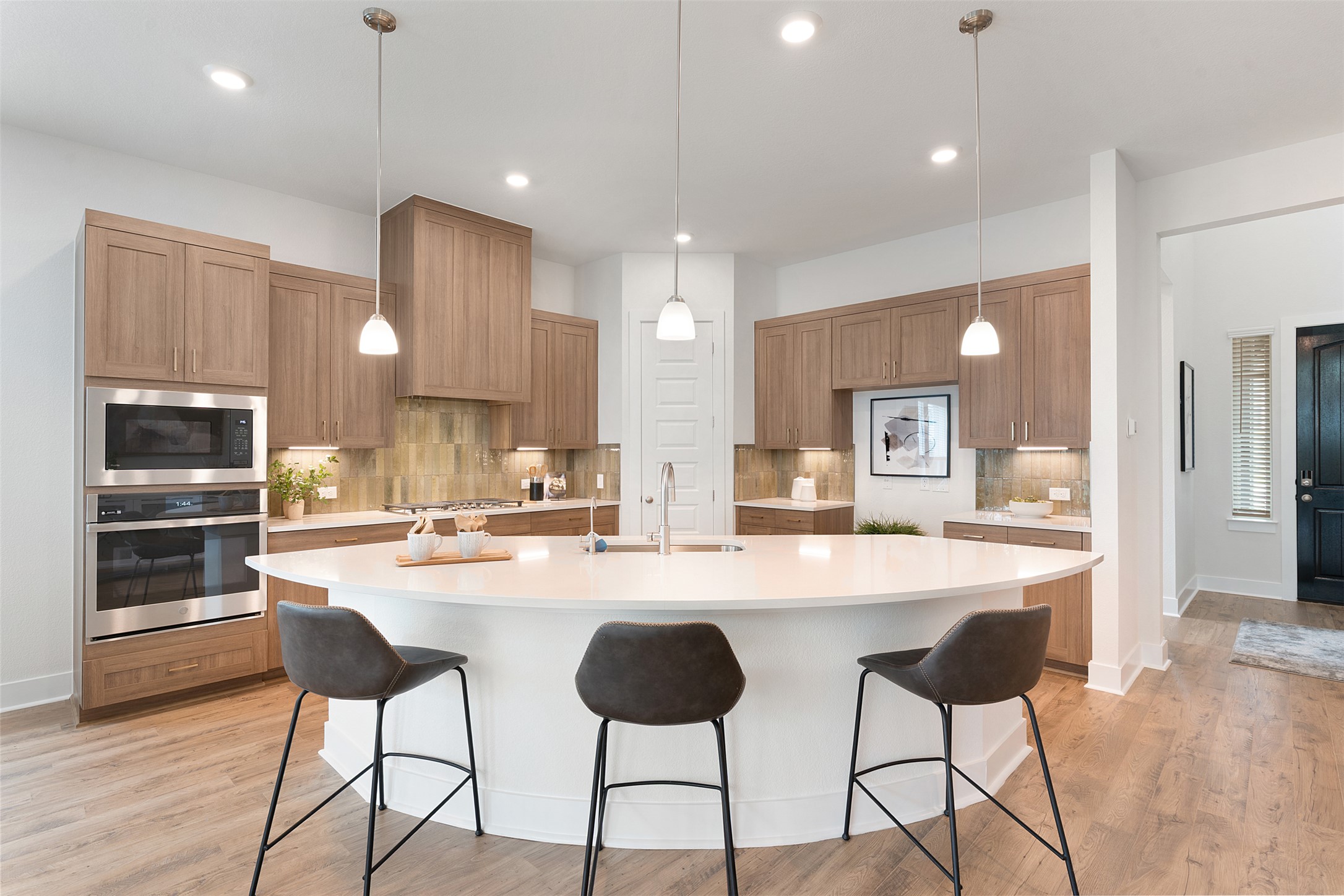 104 Beautiful Wisdom Court Georgetown, TX 78628 - Photo 7 of 33 a large kitchen with a table and chairs