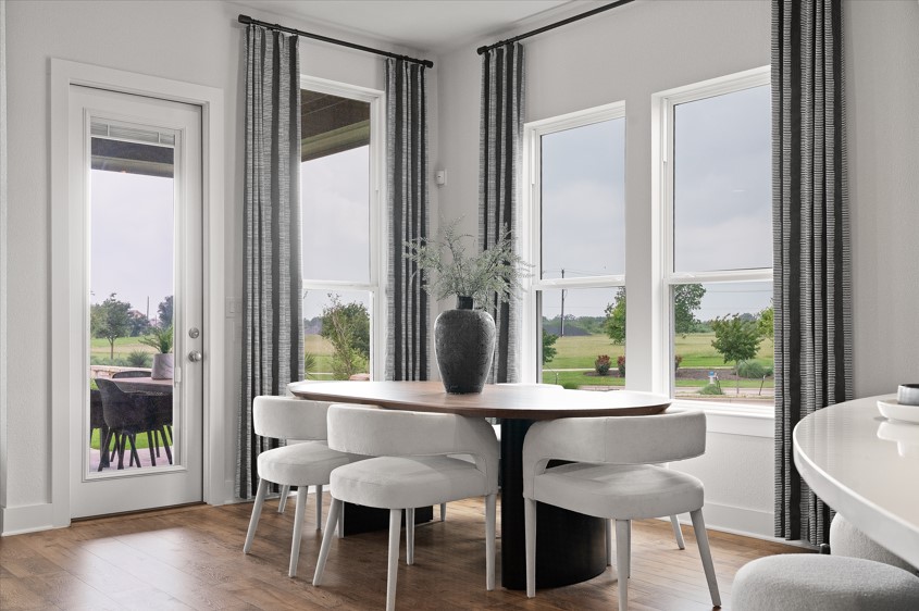 104 Beautiful Wisdom Court Georgetown, TX 78628 - Photo 7 of 29 a view of a dining room with furniture and wooden floor