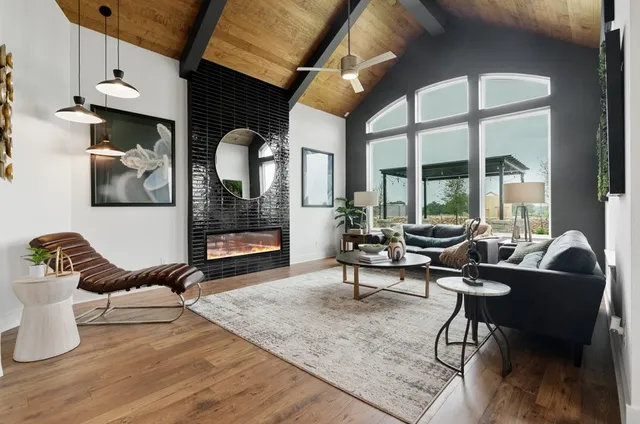 a living room with furniture rug and window