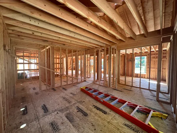an empty room with a empty space and wooden floor